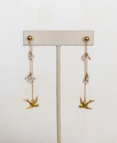 14 karat gold filled drop earrings with tiny rice pearl clusters and little swallows